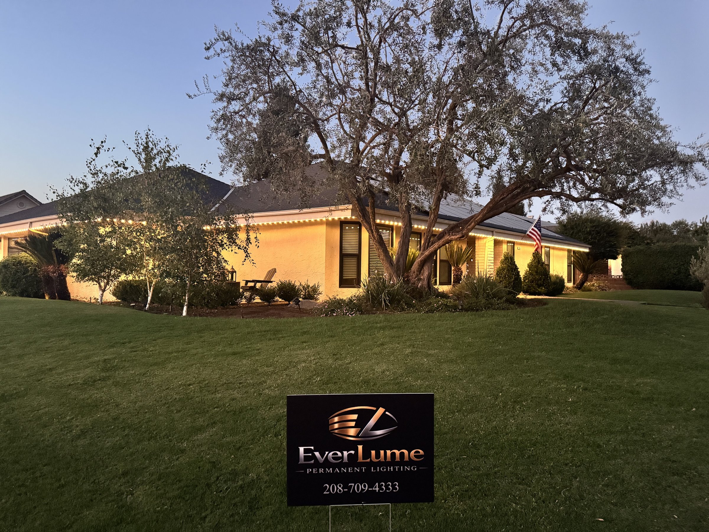 EverLume permanent roofline lighting at dusk