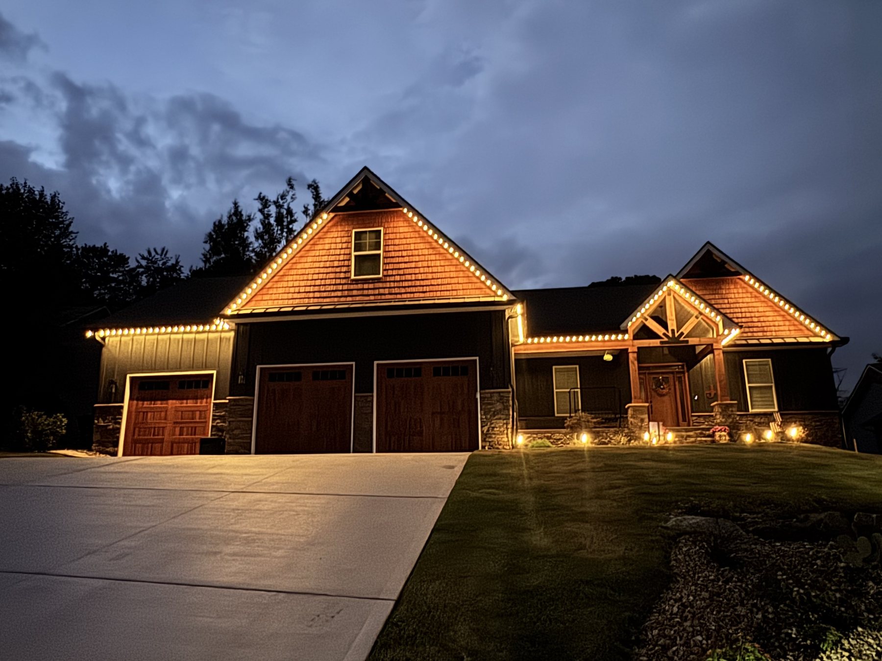 EverLume permanent lighting tracing a home's roofline at dusk